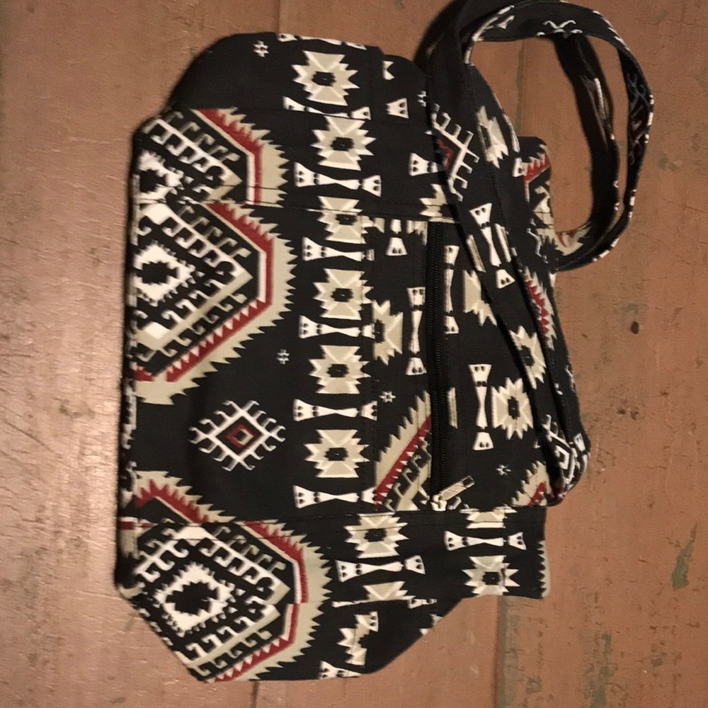 Super cute black purse with designs